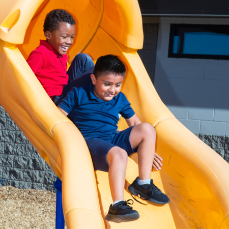 Photo: Kids sliding down slide