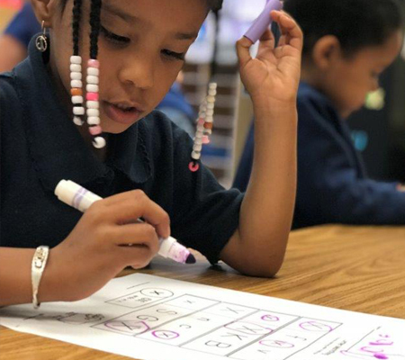 Photo: Preschool student working on paper